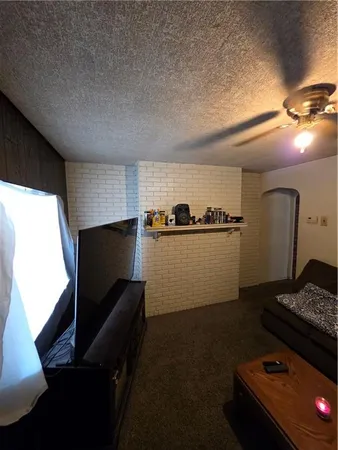 a kitchen with sink refrigerator and stove