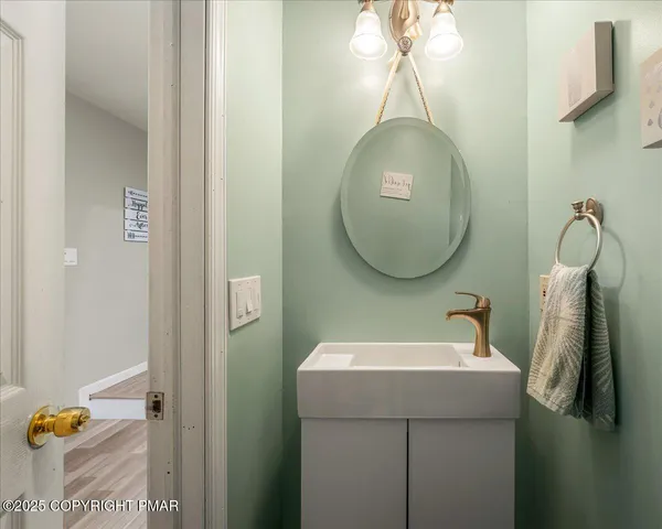 a bathroom with a sink and mirror
