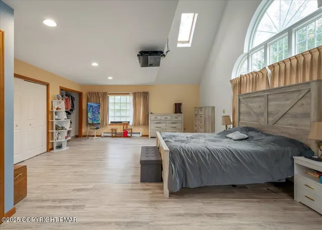 a bed room with a bed and a television