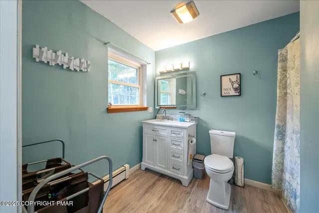 a bedroom with furniture and a wooden floor