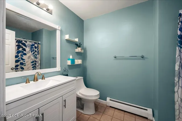 a room with furniture and a flat screen tv