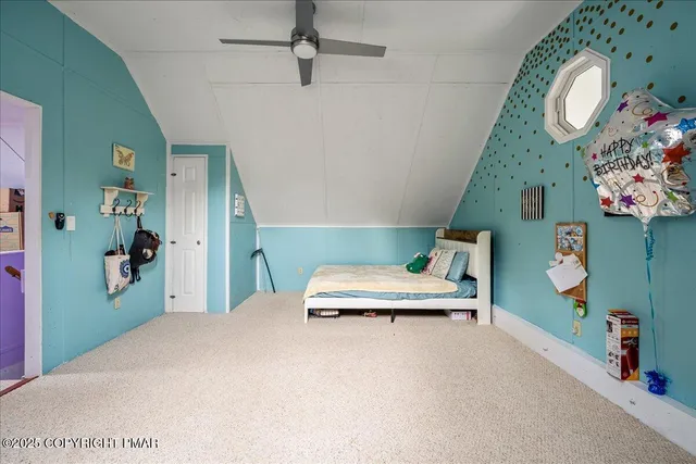 a view of a garage with furniture and a garage