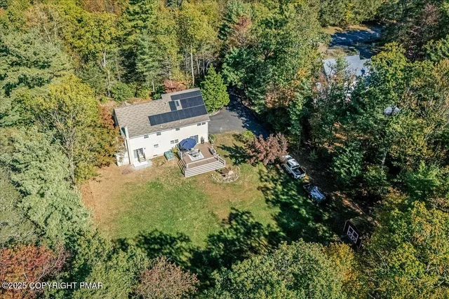 an aerial view of residential house with outdoor space