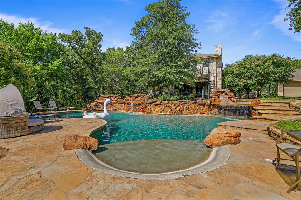 2243 Wood Hollow Road Denton, TX 76208 - Photo 14 of 40 Resort style pool with beach entrance and cascading waterfall