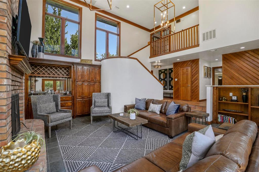 2243 Wood Hollow Road Denton, TX 76208 - Photo 19 of 40 Living room looking up at stairs to primary bedroom