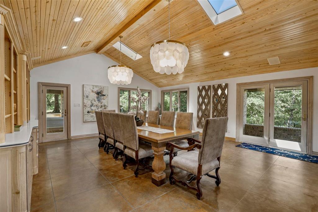 2243 Wood Hollow Road Denton, TX 76208 - Photo 23 of 40 Gorgeous dining room with vaulted wood ceilings and built-in cabinets/shelving. Perfect for large gatherings