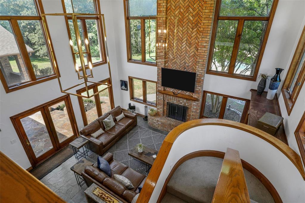 2243 Wood Hollow Road Denton, TX 76208 - Photo 28 of 40 Two story living room with fireplace and large picture windows