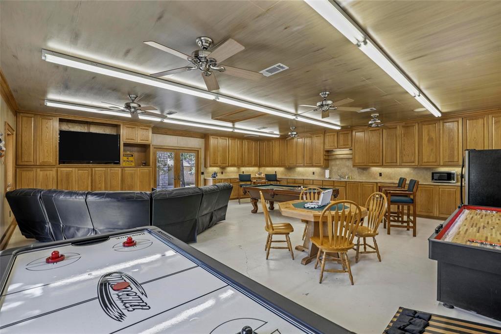 2243 Wood Hollow Road Denton, TX 76208 - Photo 37 of 40 Workshop has new AC, refrigerator and sink.