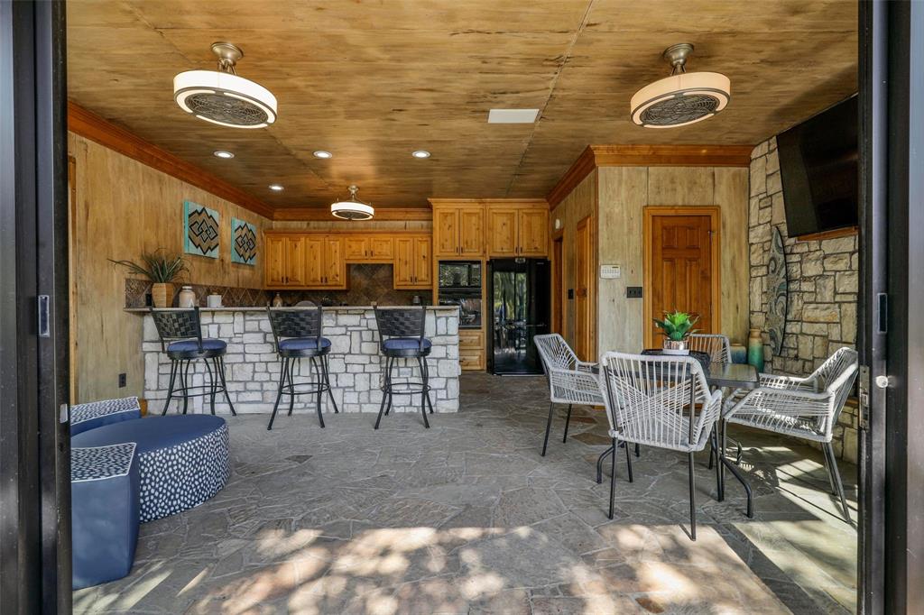 2243 Wood Hollow Road Denton, TX 76208 - Photo 9 of 40 Pool house with full kitchen and fireplace