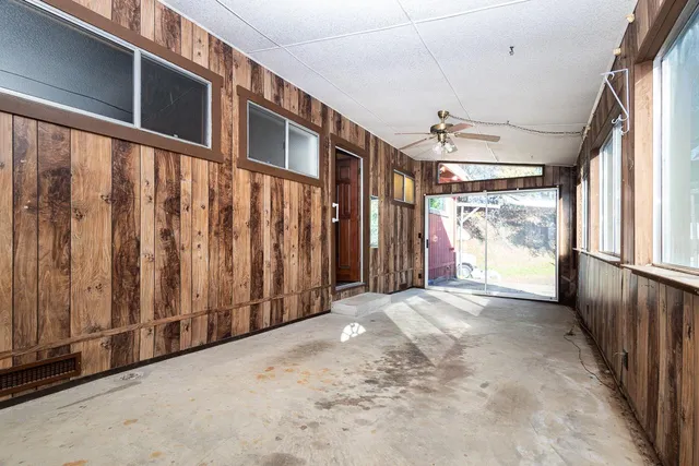 a view of a porch with wooden floor and stairs
