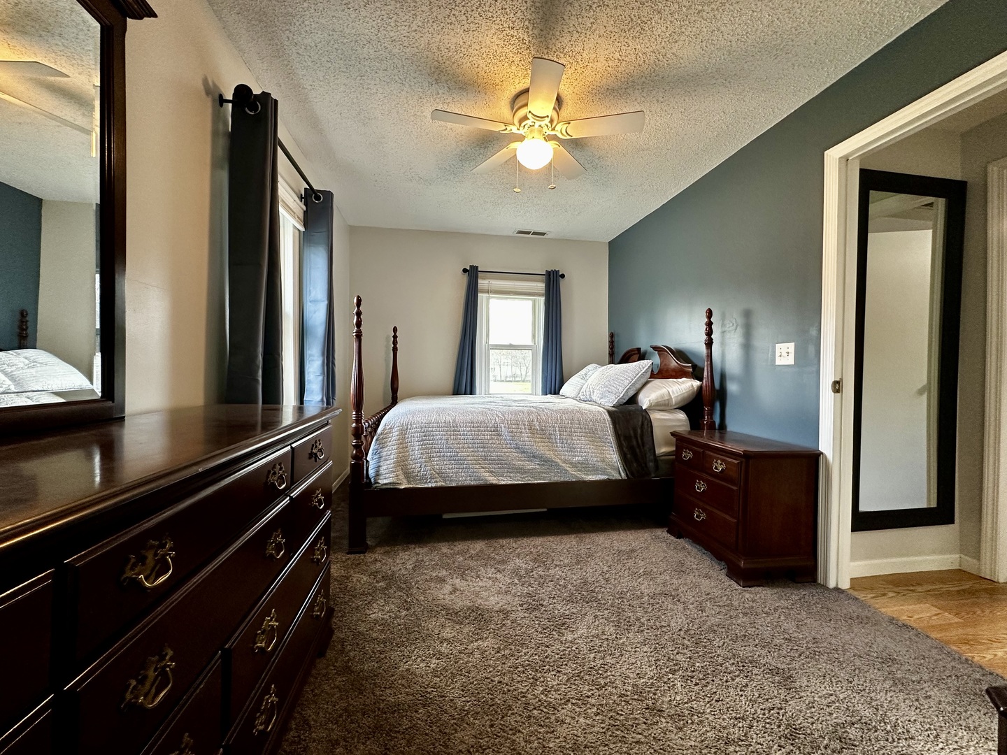 442 East Devonshire Road Decatur, IL 62521 - Photo 3 of 16 a bedroom with a bed and a chandelier
