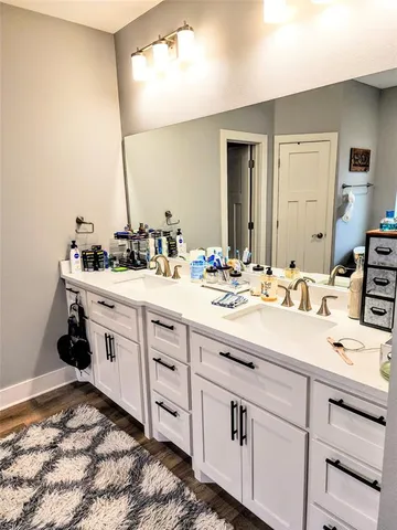 a view of a bathtub in a bathroom next to a window
