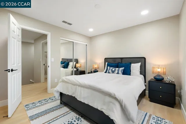 a bedroom with a bed and a closet