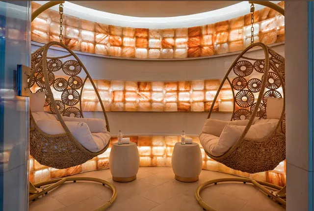 a bedroom with a bed and a table