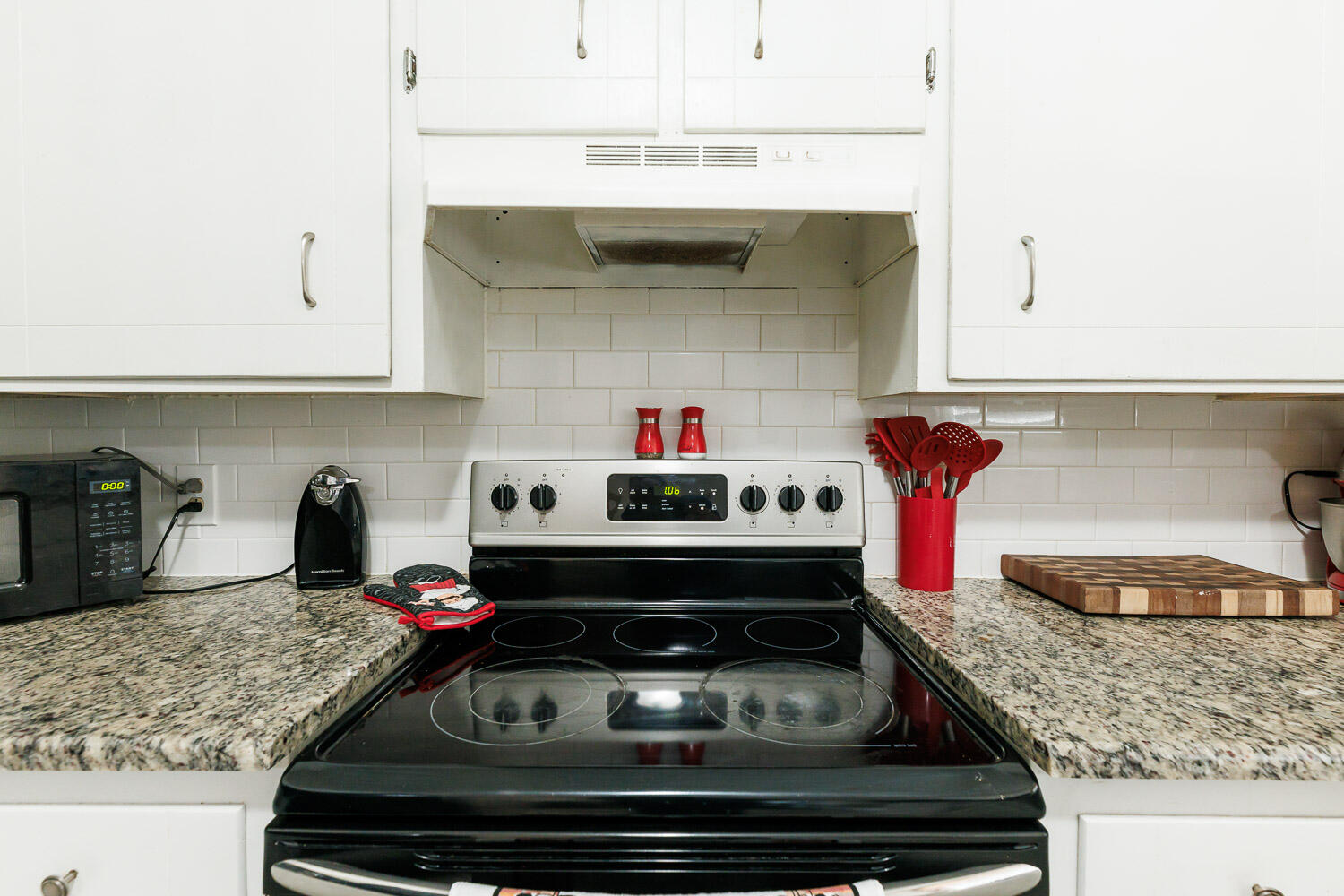 1907 73rd Street Lubbock, TX 79423 - Photo 15 of 41 a kitchen with a stove and cabinets