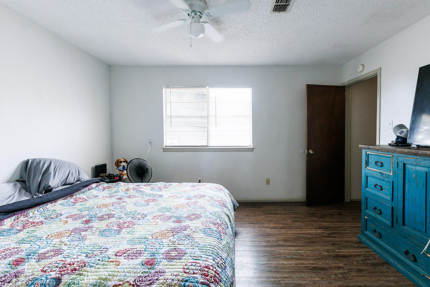 1907 73rd Street Lubbock, TX 79423 - Photo 17 of 41 a bedroom with a bed and a dresser