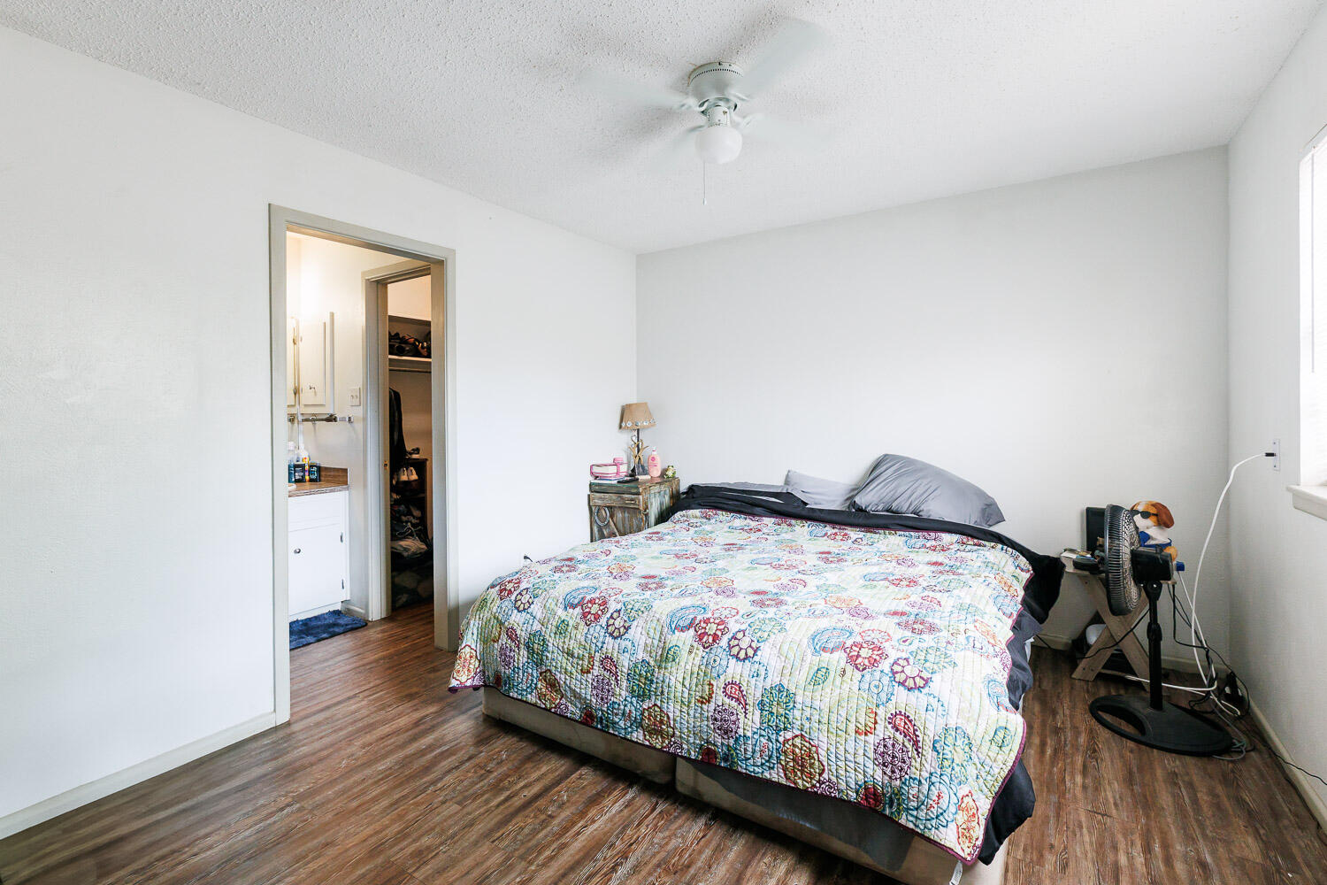 1907 73rd Street Lubbock, TX 79423 - Photo 18 of 41 a bedroom with a bed and wooden floor