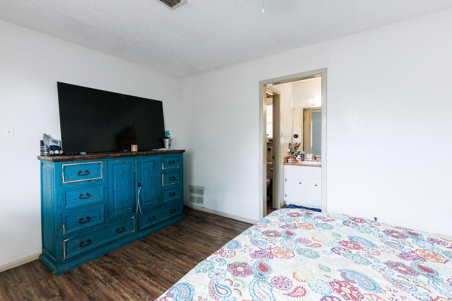 1907 73rd Street Lubbock, TX 79423 - Photo 19 of 41 a bedroom with a bed and a television