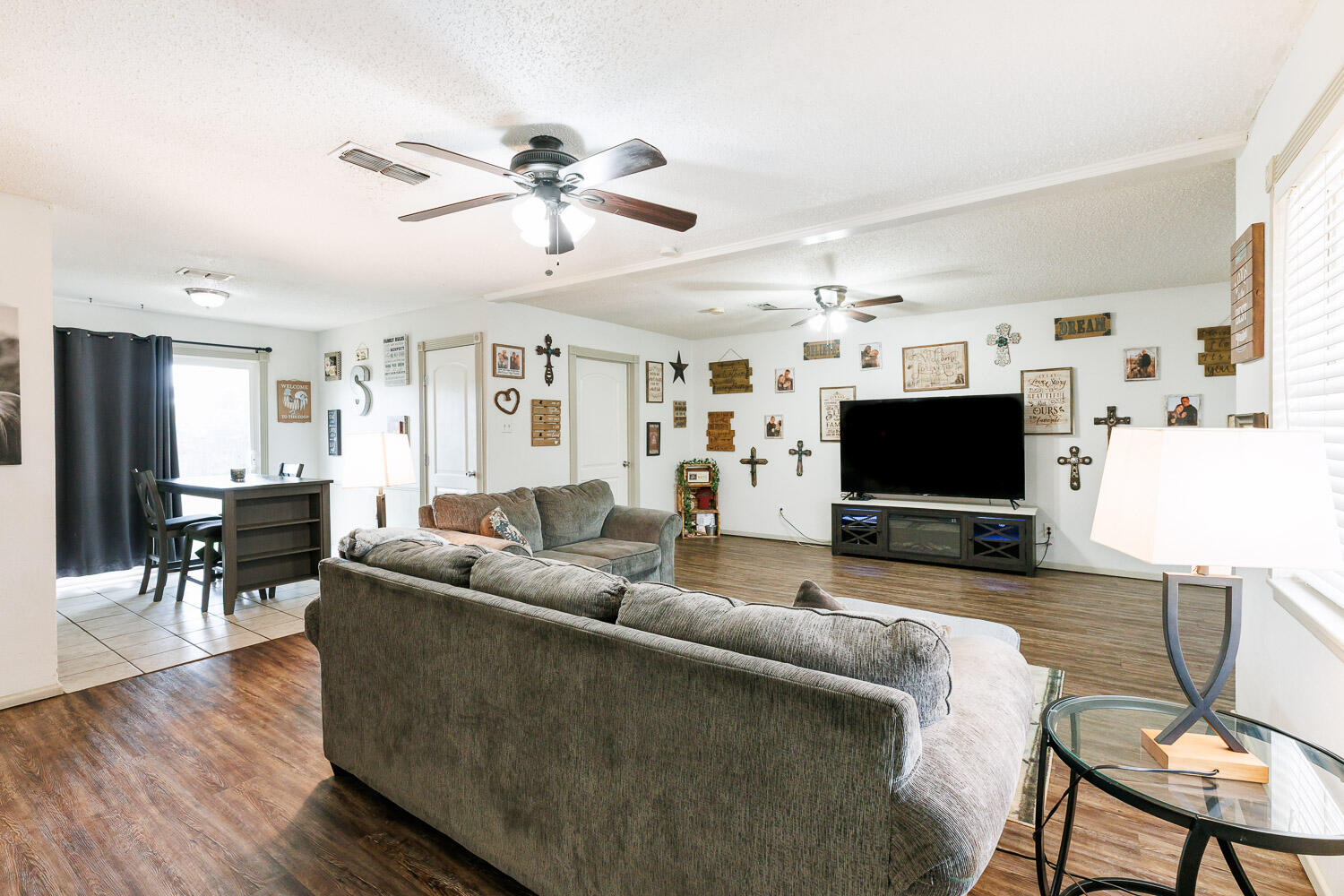 1907 73rd Street Lubbock, TX 79423 - Photo 2 of 41 a living room with furniture and a flat screen tv