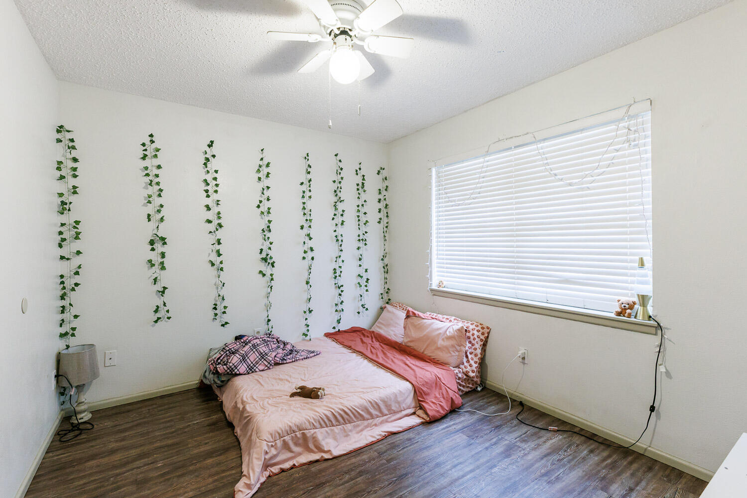 1907 73rd Street Lubbock, TX 79423 - Photo 26 of 41 a bedroom with a bed and a window