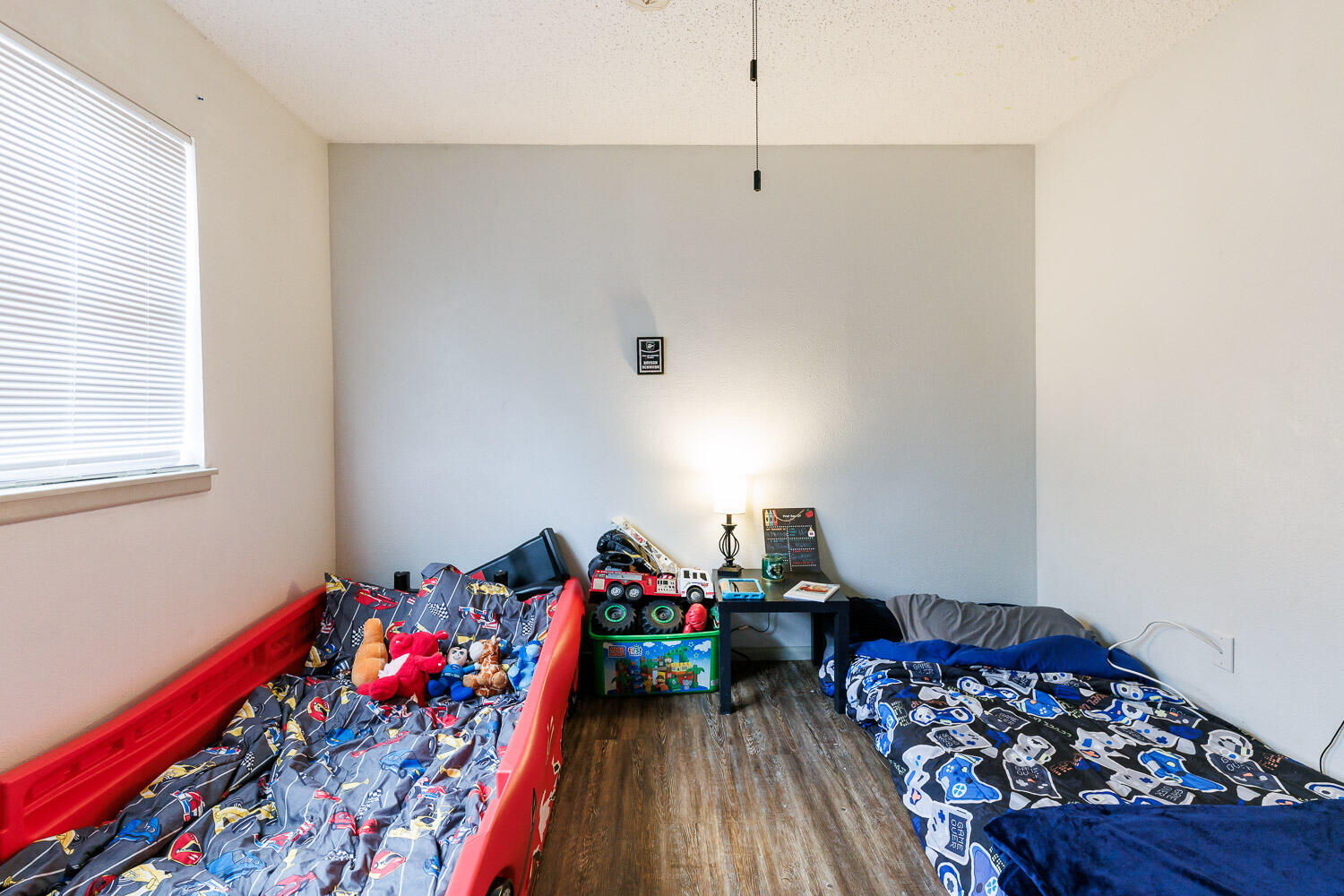 1907 73rd Street Lubbock, TX 79423 - Photo 31 of 41 a bed room with furniture and a window