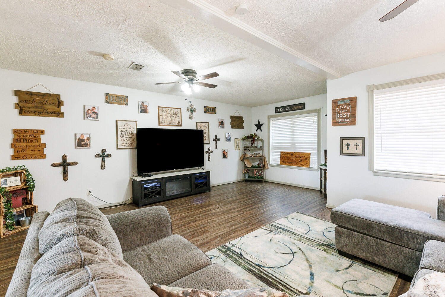 1907 73rd Street Lubbock, TX 79423 - Photo 7 of 41 a living room with furniture and a flat screen tv