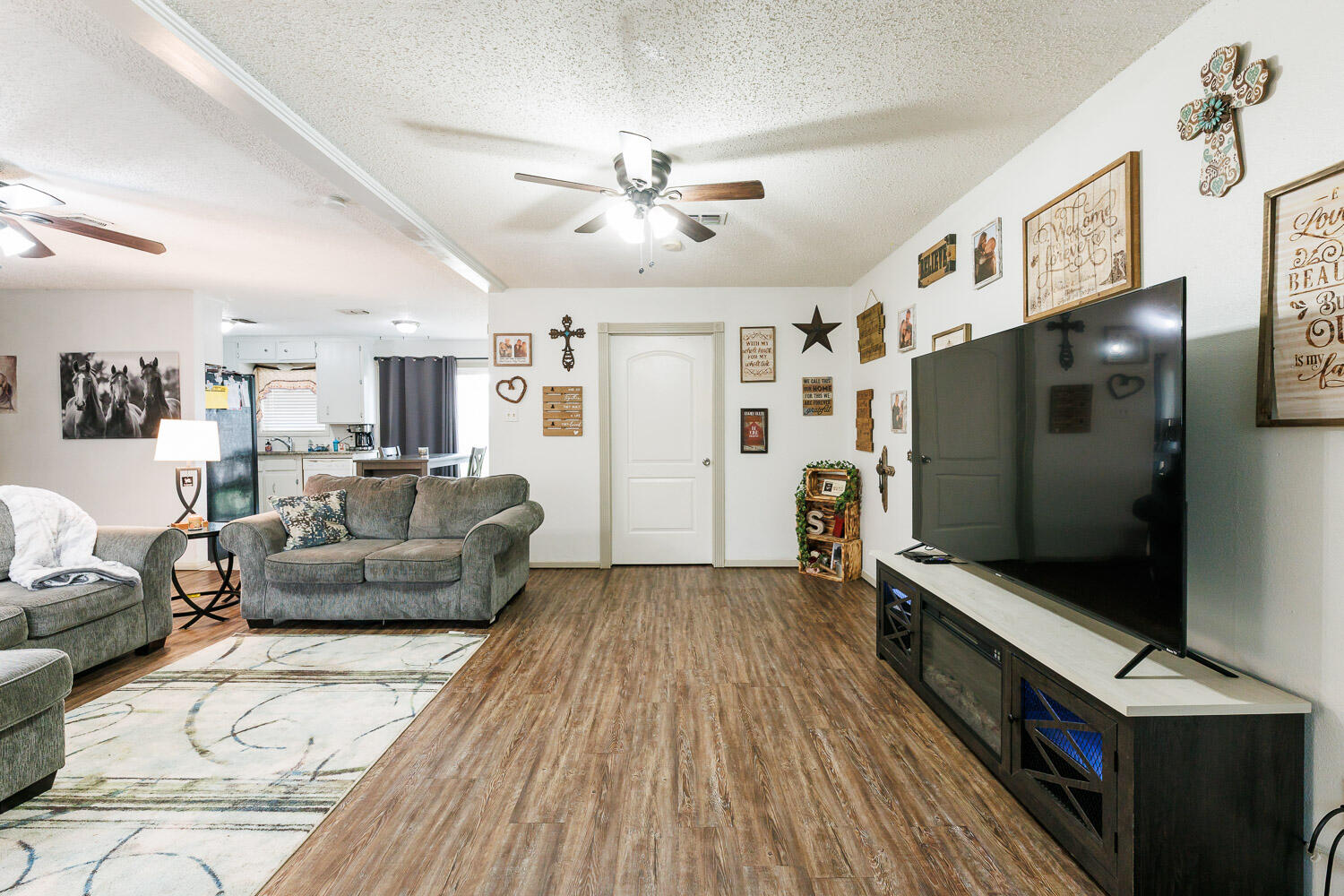 1907 73rd Street Lubbock, TX 79423 - Photo 9 of 41 a living room with furniture and a flat screen tv