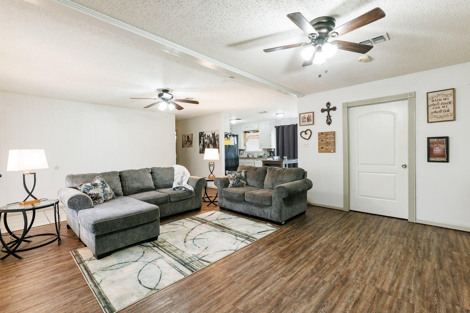 1907 73rd Street Lubbock, TX 79423 - Photo 10 of 41 a living room with furniture and a ceiling fan