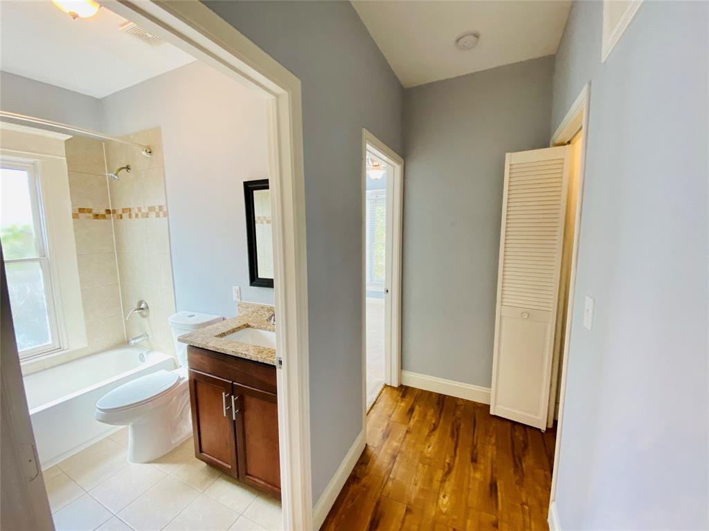 4318 Junius Street, Unit 3 Dallas, TX 75246 - Photo 12 of 29 a view of bathroom with tub and mirror