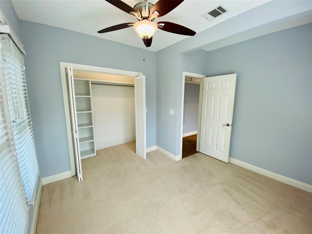 4318 Junius Street, Unit 3 Dallas, TX 75246 - Photo 18 of 29 an empty room with closet and a ceiling fan
