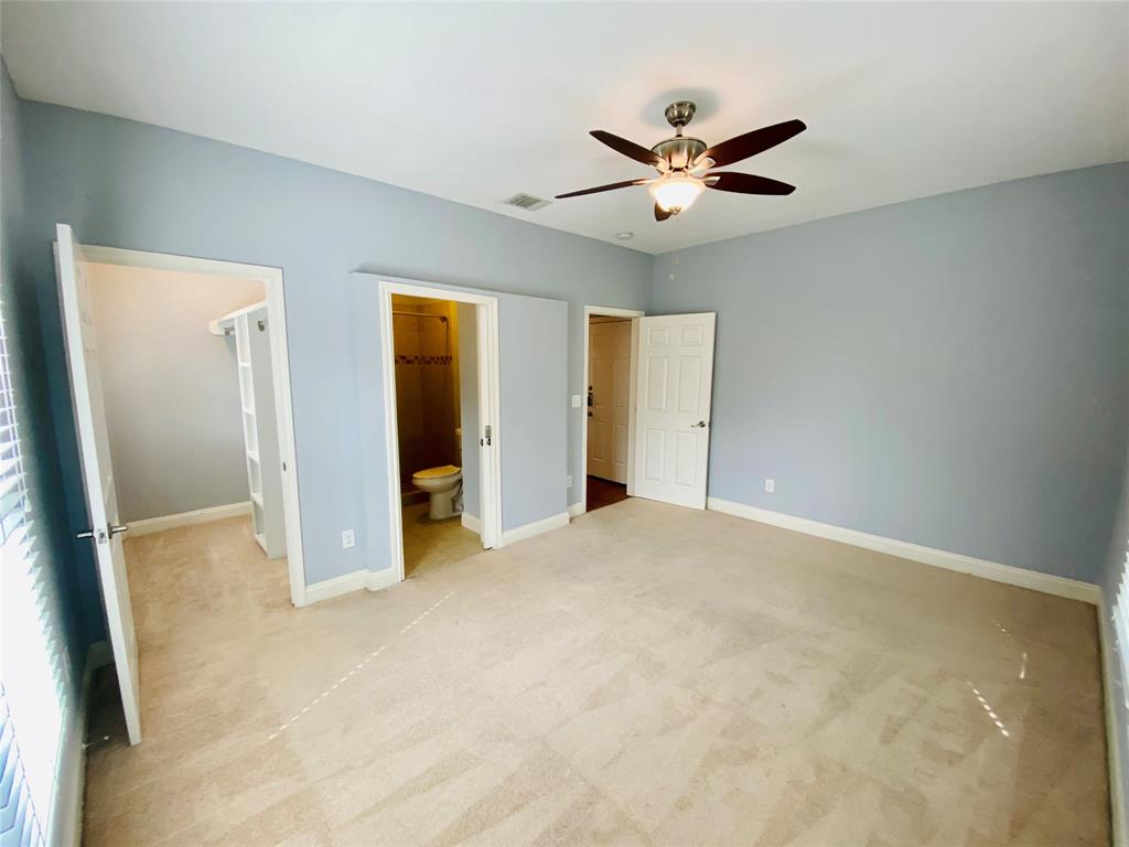 4318 Junius Street, Unit 3 Dallas, TX 75246 - Photo 22 of 29 an empty room with closet and windows