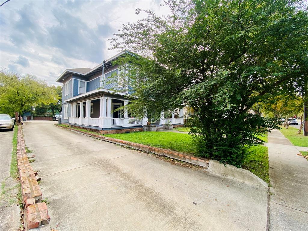 4318 Junius Street, Unit 3 Dallas, TX 75246 - Photo 29 of 29 a view of a house with a swimming pool