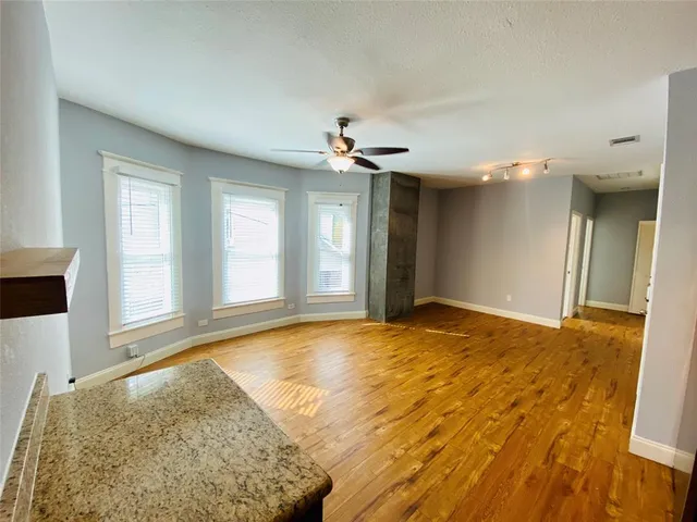 a view of an empty room and window