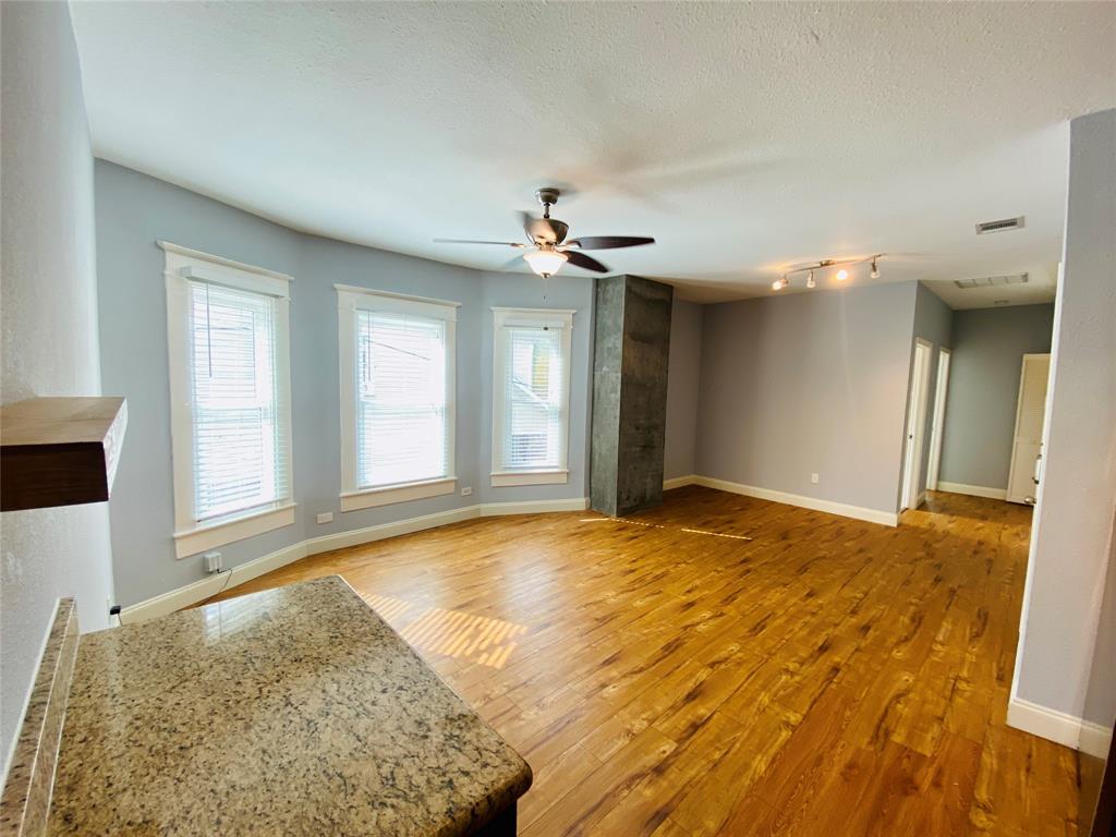 4318 Junius Street, Unit 3 Dallas, TX 75246 - Photo 9 of 29 a view of an empty room and window