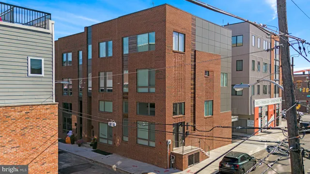 a front view of a building with glass windows