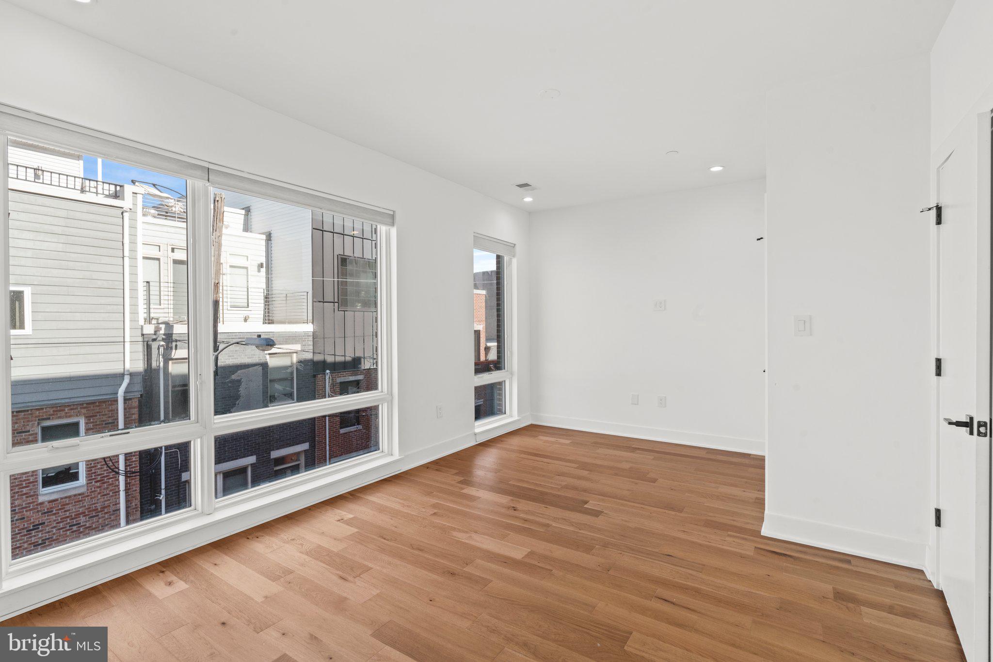 2240 League Street Philadelphia, PA 19146 - Photo 21 of 43 wooden floor in an empty room with a window