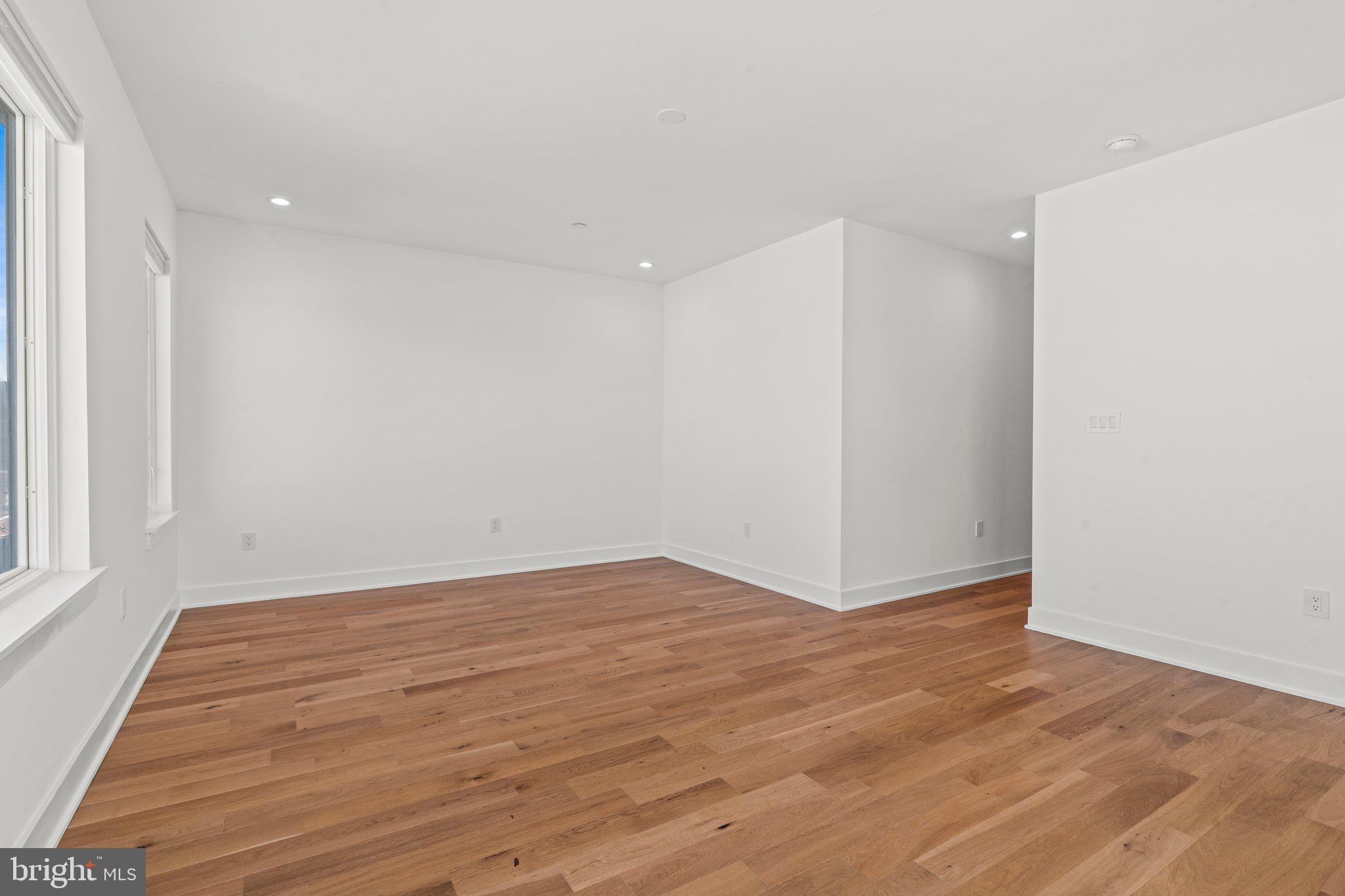 2240 League Street Philadelphia, PA 19146 - Photo 27 of 43 a view of an empty room with wooden floor and a window