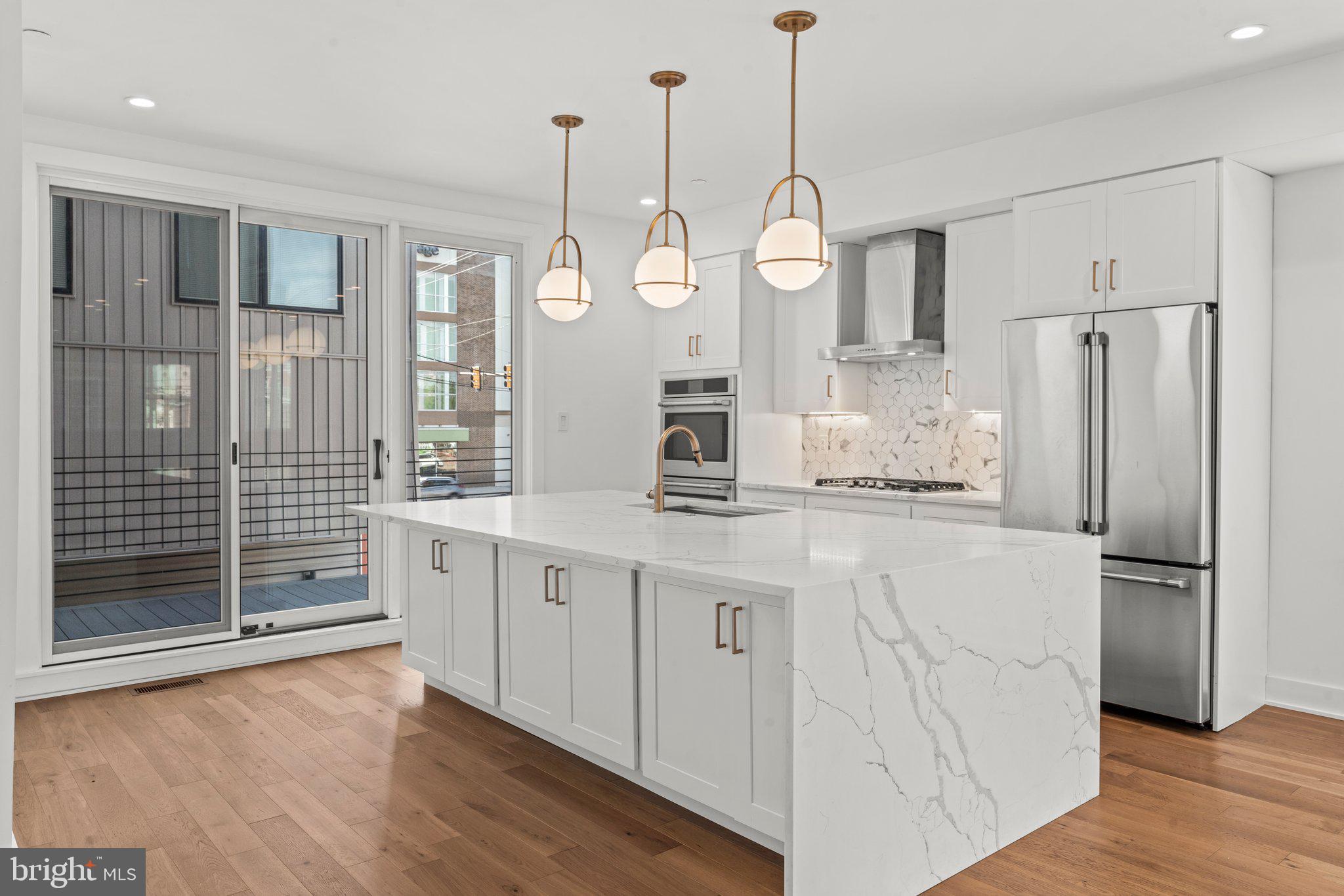 2240 League Street Philadelphia, PA 19146 - Photo 5 of 43 a kitchen with stainless steel appliances a refrigerator sink and cabinets