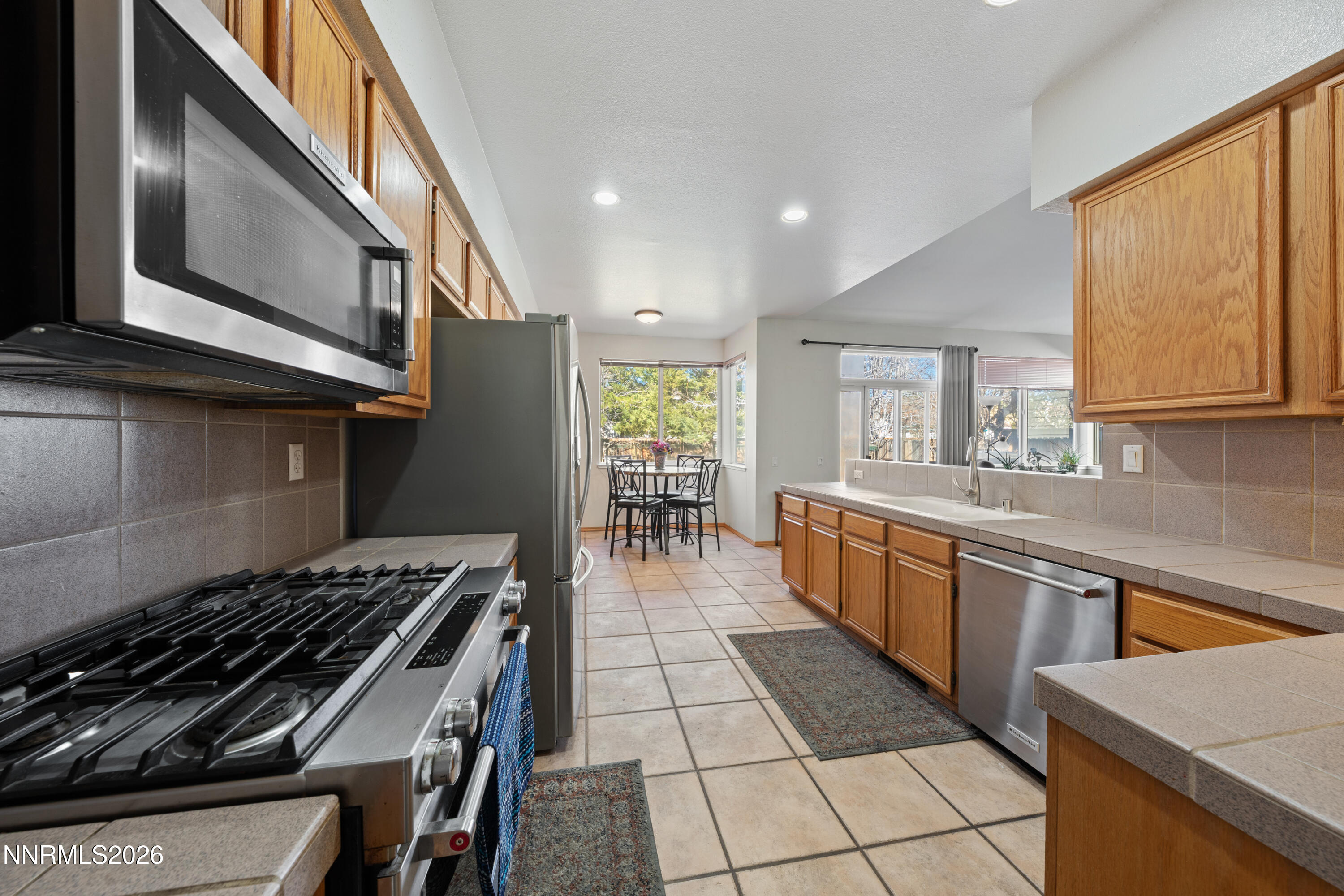 3225 Eaglewood Drive Reno, NV 89502 - Photo 11 of 45 a kitchen with lots of counter top space and wooden floor