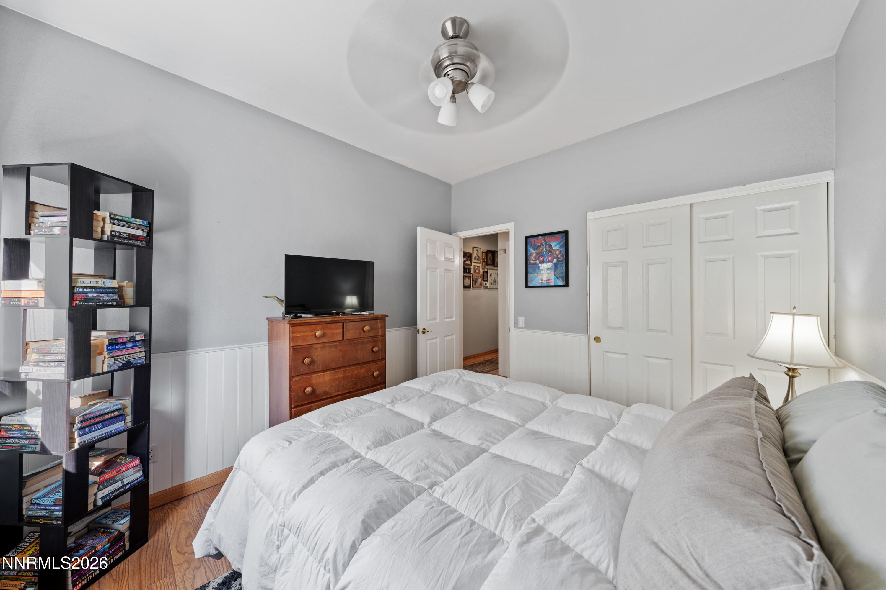 3225 Eaglewood Drive Reno, NV 89502 - Photo 19 of 45 a bedroom with a bed and a flat screen tv