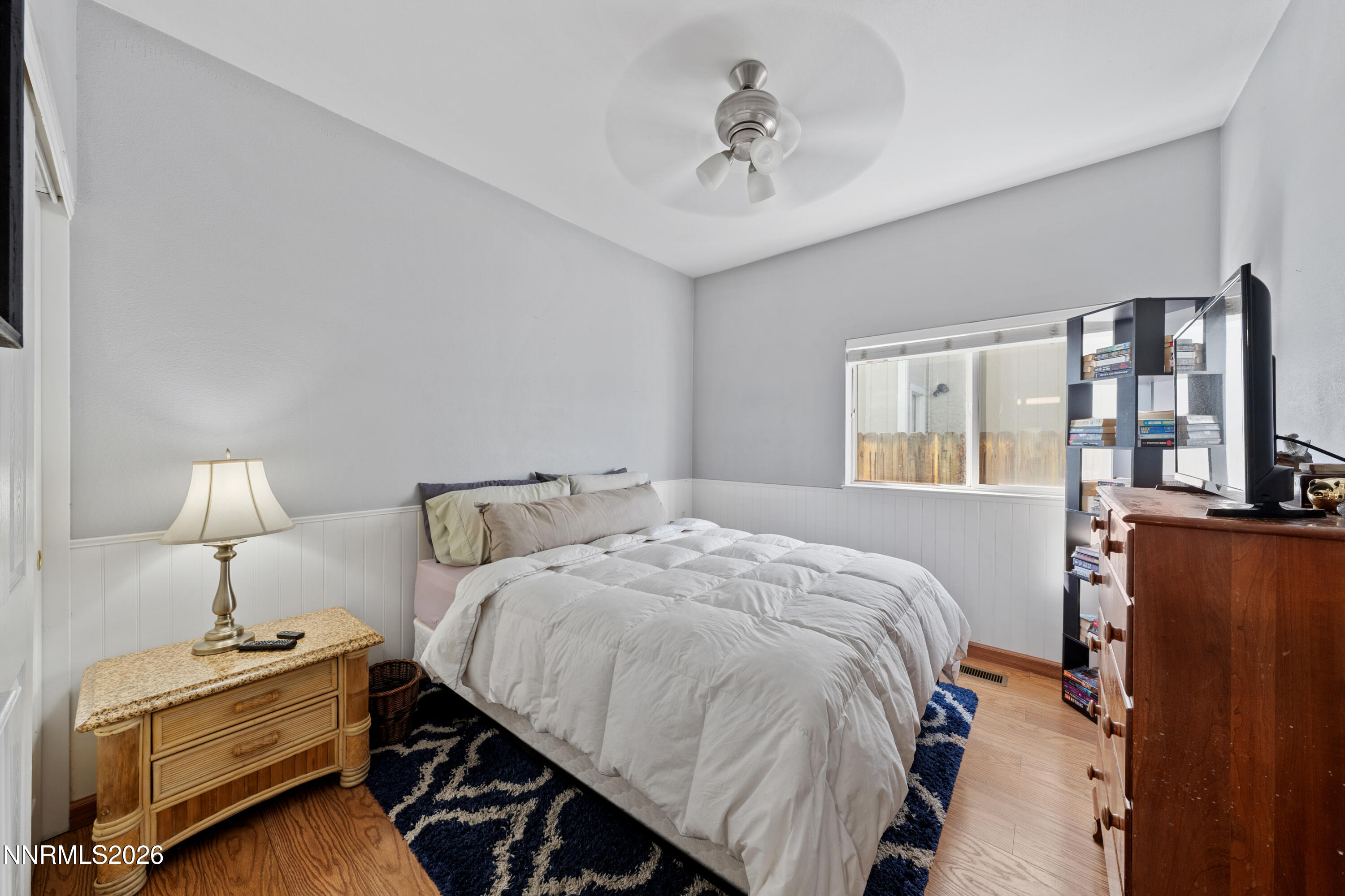 3225 Eaglewood Drive Reno, NV 89502 - Photo 20 of 45 a bedroom with a bed and wooden floor