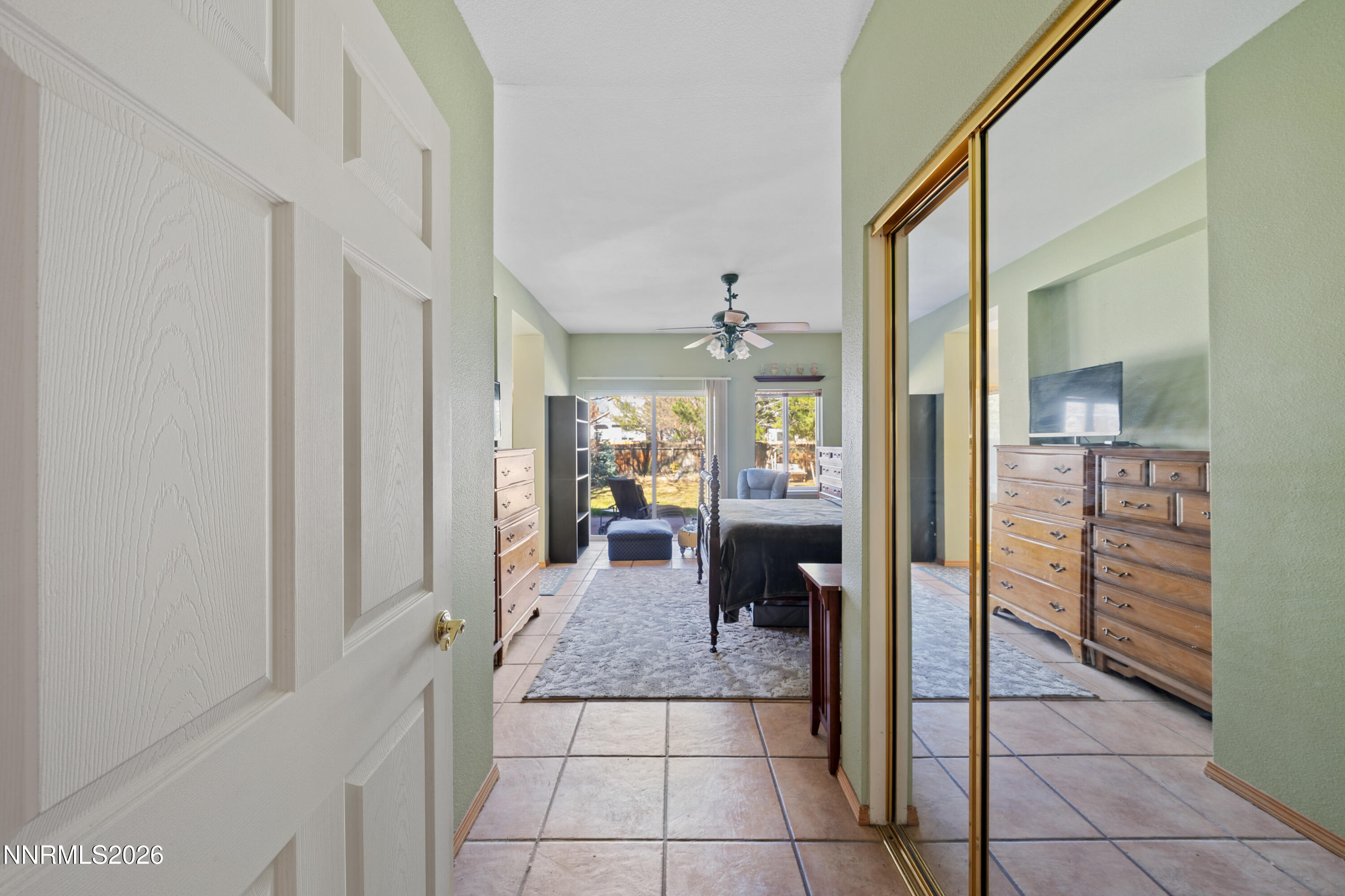 3225 Eaglewood Drive Reno, NV 89502 - Photo 24 of 45 a hallway with a closet and a mirror
