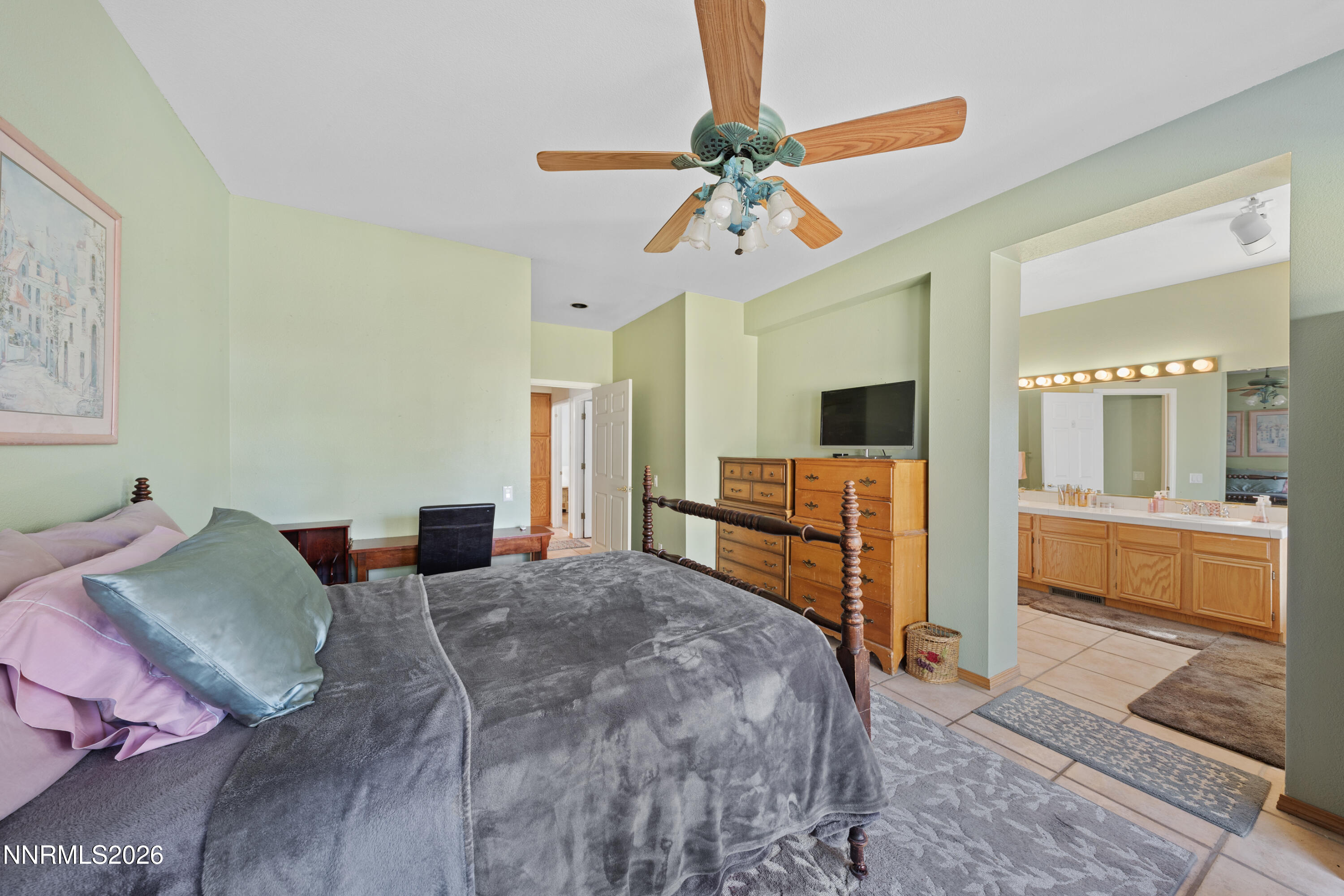 3225 Eaglewood Drive Reno, NV 89502 - Photo 26 of 45 a bedroom with a bed and a chandelier