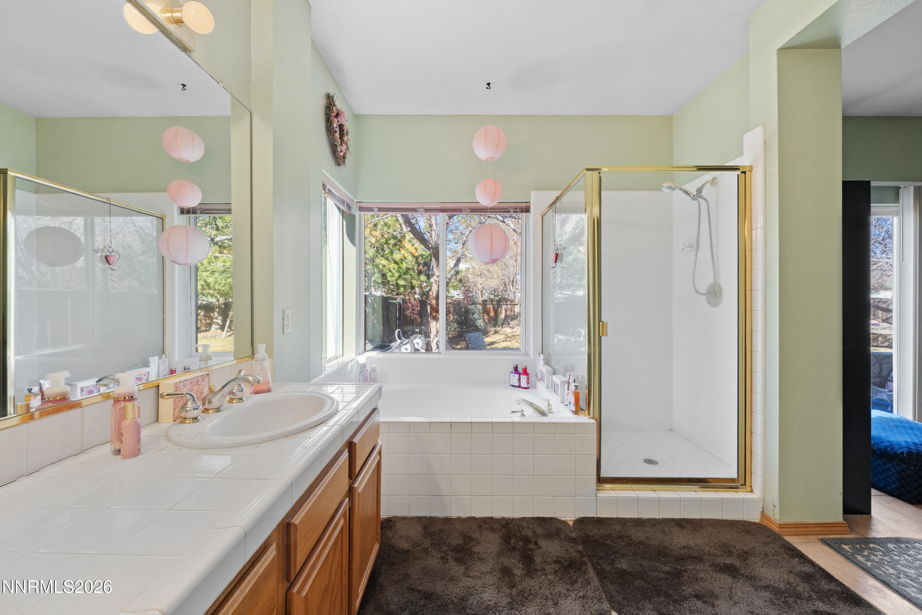 3225 Eaglewood Drive Reno, NV 89502 - Photo 28 of 45 a bathroom with a tub sink and mirror