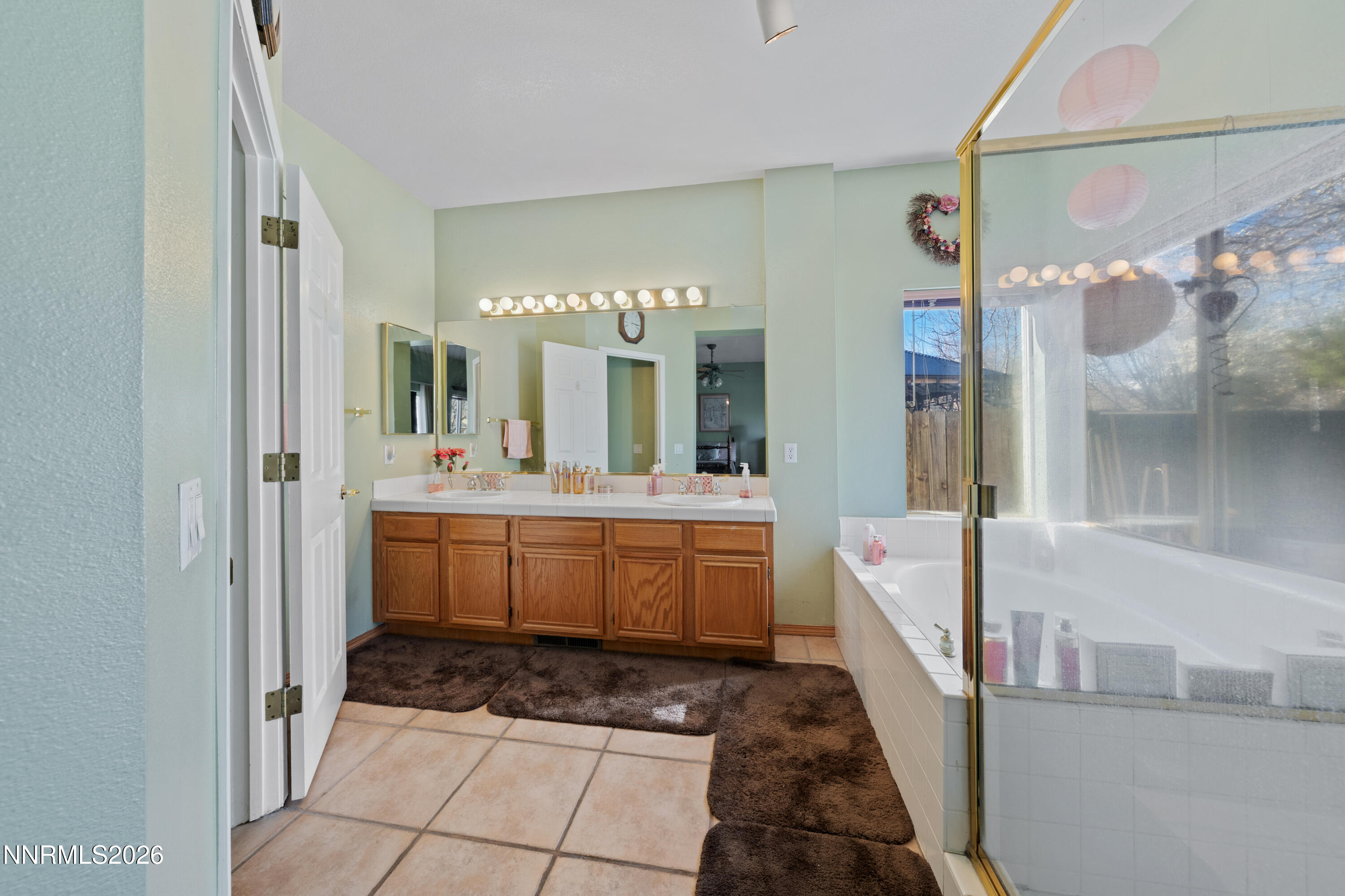 3225 Eaglewood Drive Reno, NV 89502 - Photo 29 of 45 a large bathroom with a glass door shower and sink