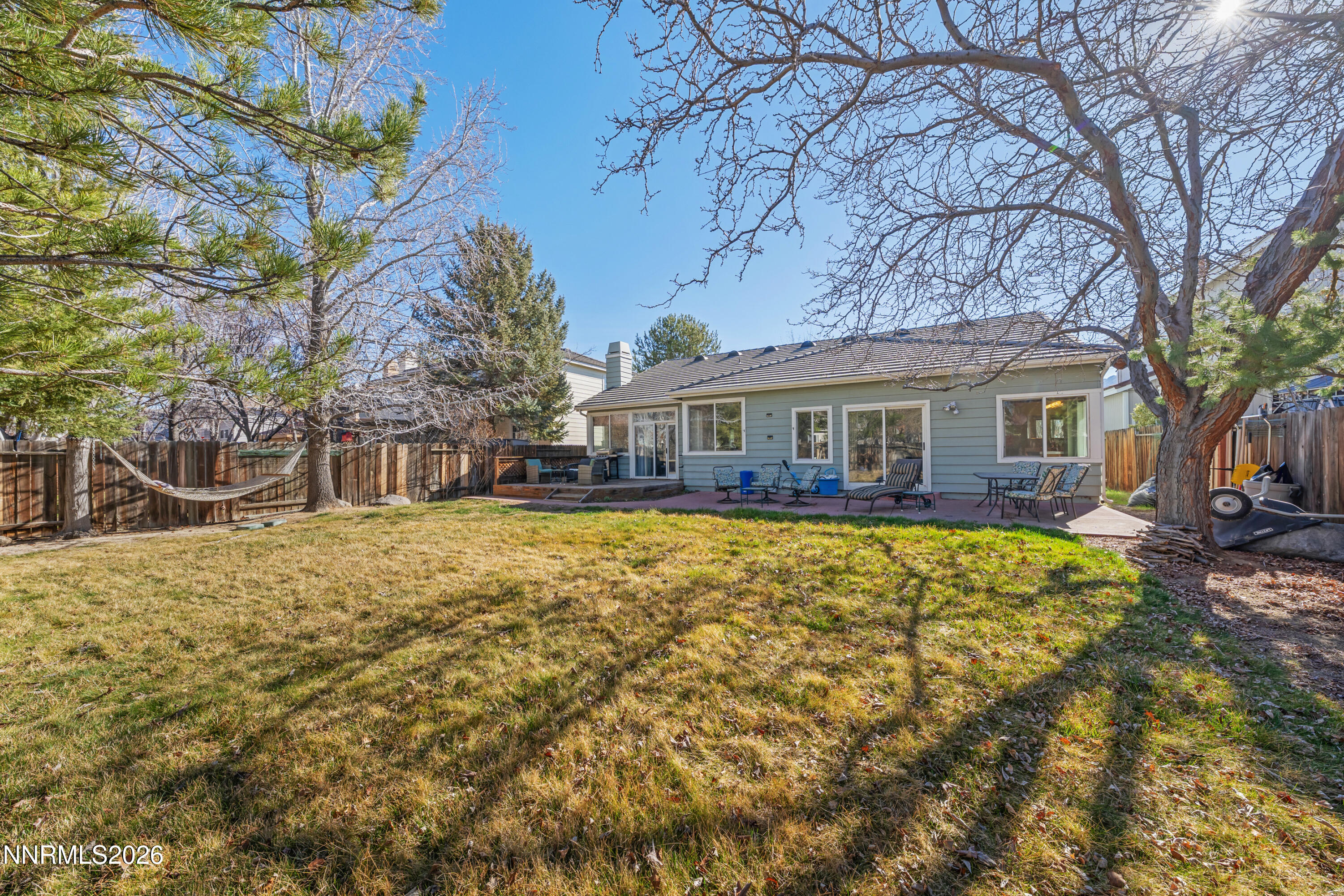 3225 Eaglewood Drive Reno, NV 89502 - Photo 33 of 45 a front view of house with yard space and swimming pool