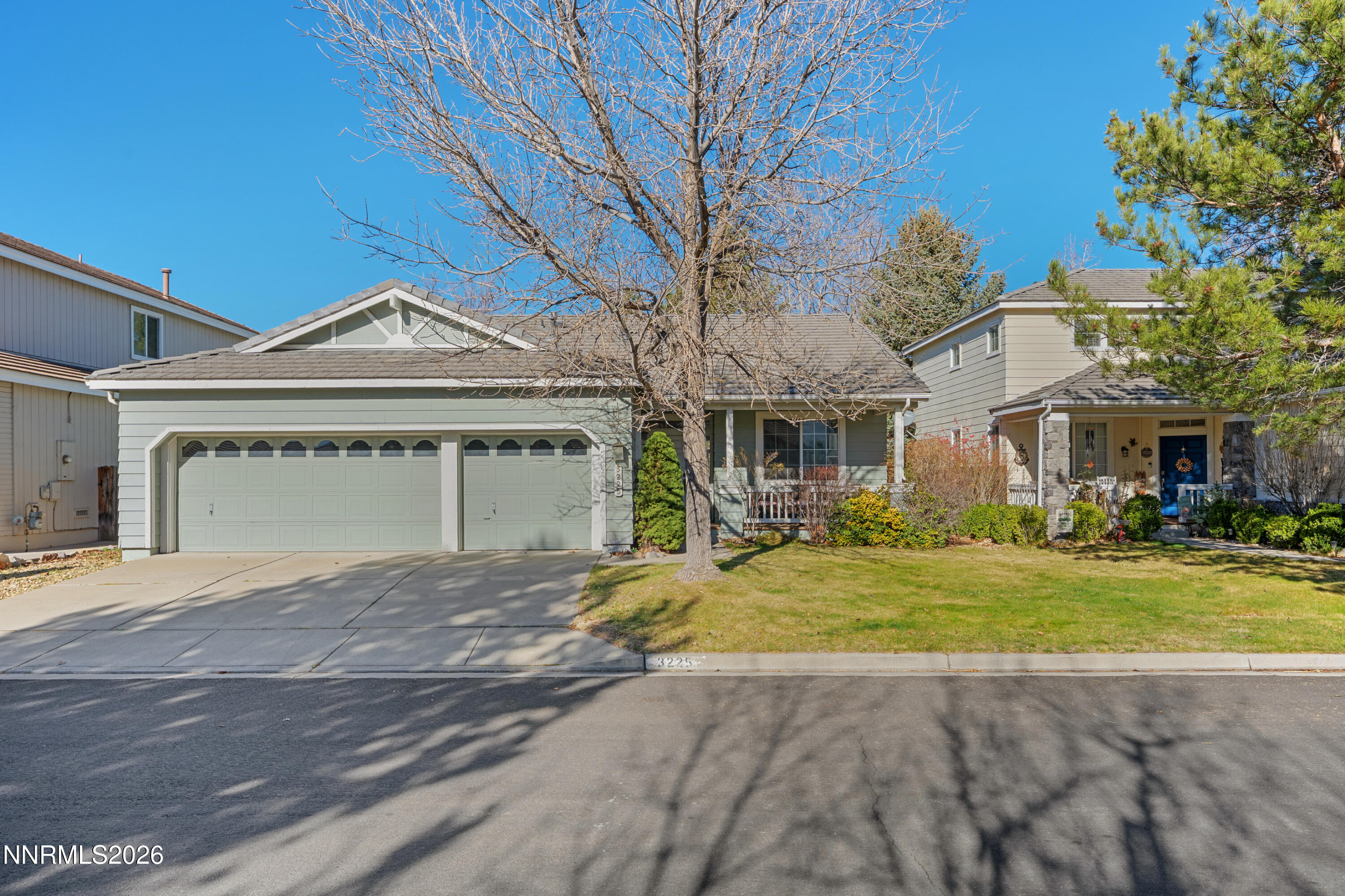 3225 Eaglewood Drive Reno, NV 89502 - Photo 39 of 45 a front view of a house with a garden and trees