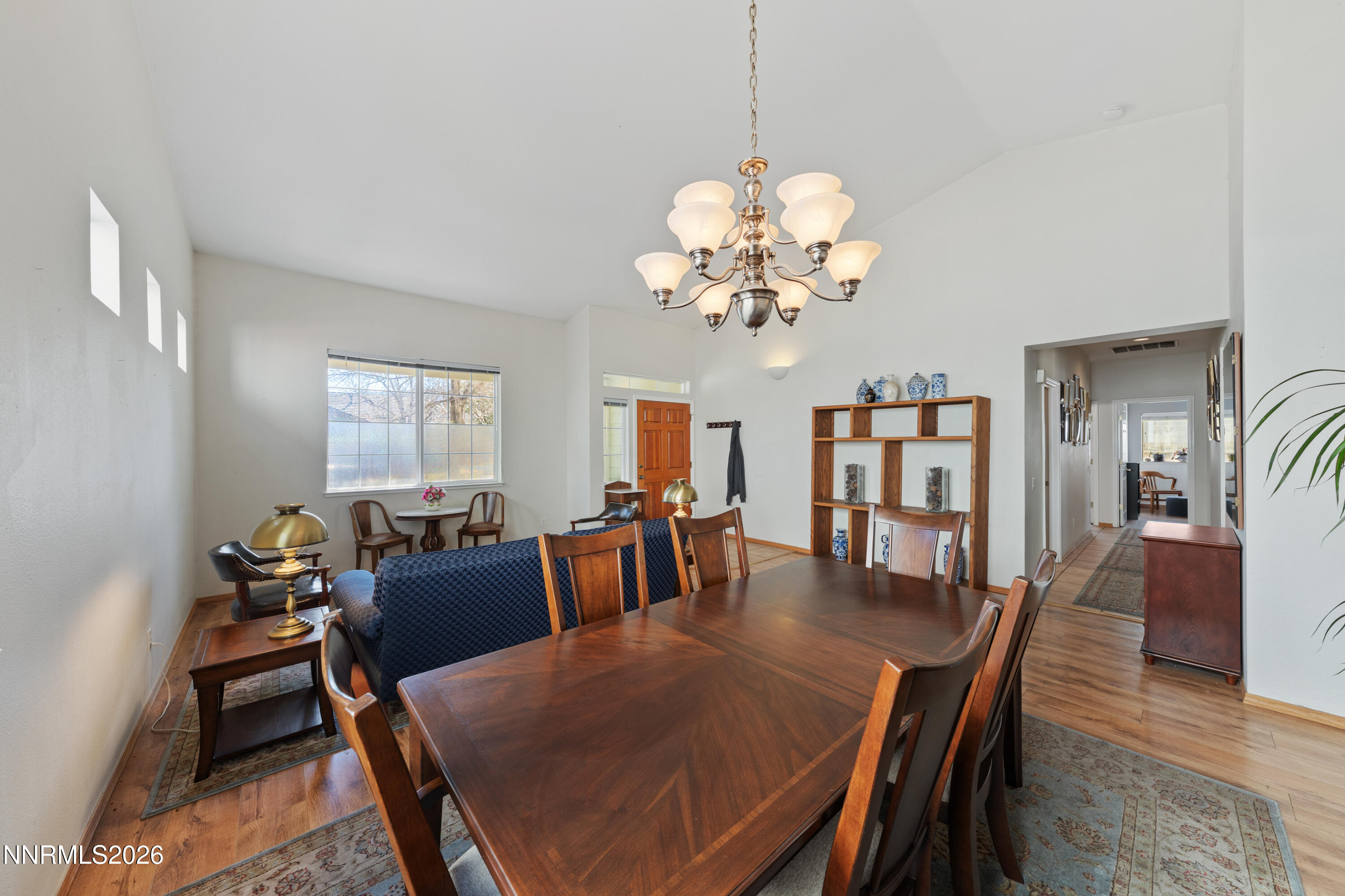3225 Eaglewood Drive Reno, NV 89502 - Photo 4 of 45 a view of a dining room with furniture a chandelier and wooden floor