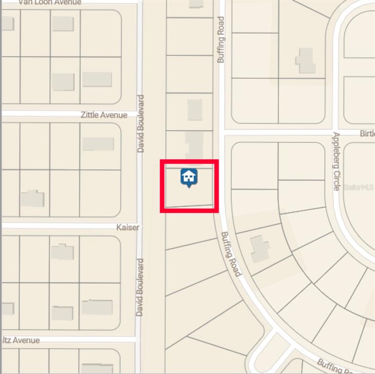 12357 Buffing Road Port Charlotte, FL 33981 - Photo 3 of 3 a room with window and a white wooden floor