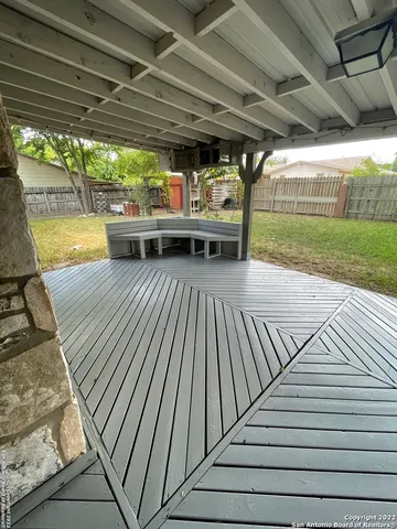 a view of outdoor space with wooden floor